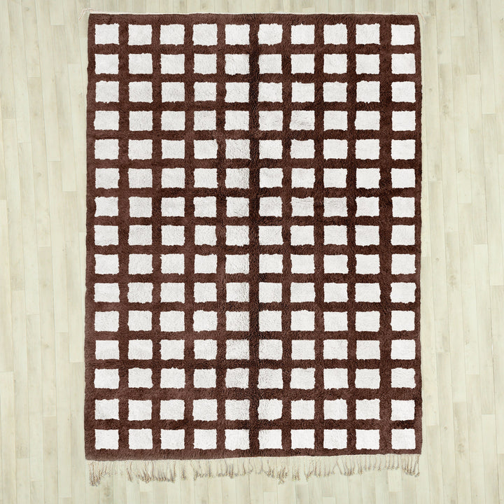 A shag Moroccan Beni Ourain Brown and White checkered rug